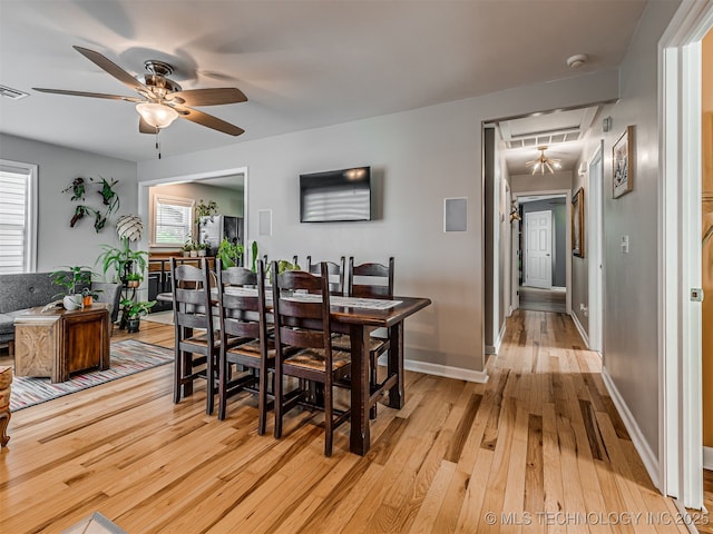 3215 W 41st St, Tulsa, OK 74107 - dining space with a ceiling fan, light wood-type flooring, healthy amount of natural light, and attic access