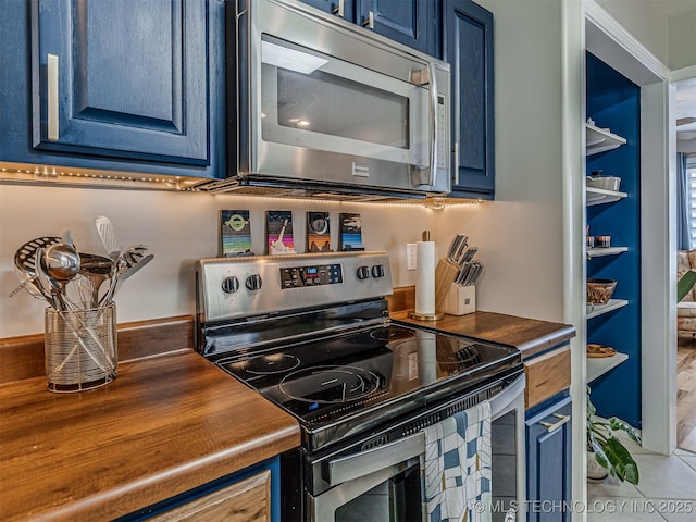 3215 W 41st St, Tulsa, OK 74107 - kitchen featuring stainless steel appliances and blue cabinets