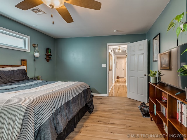 3215 W 41st St, Tulsa, OK 74107 - bedroom featuring light wood finished floors, baseboards, and ceiling fan