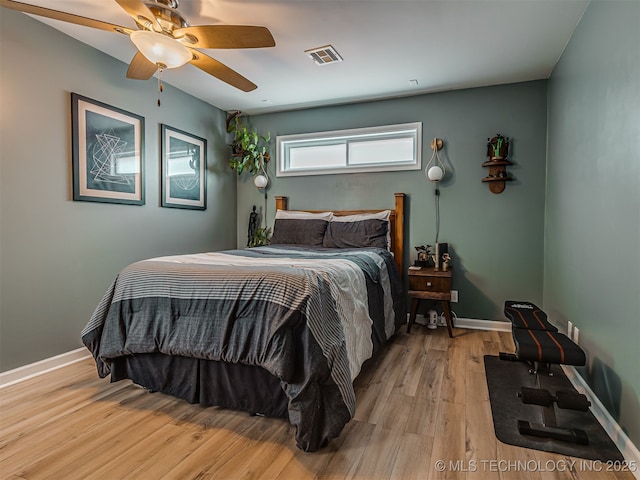 3215 W 41st St, Tulsa, OK 74107 - bedroom featuring wood finished floors, ceiling fan, and baseboards