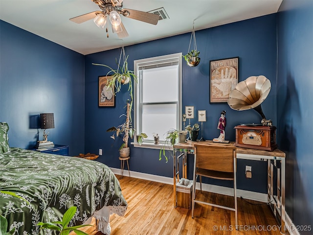 3215 W 41st St, Tulsa, OK 74107 - bedroom with wood finished floors, baseboards, and an office area
