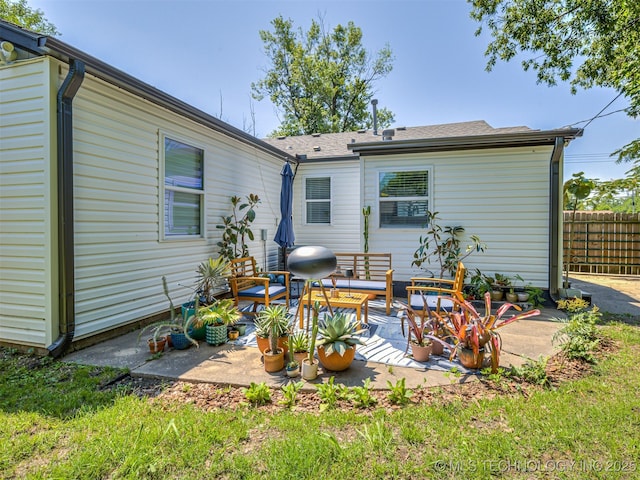 3215 W 41st St, Tulsa, OK 74107 - back of house with roof with shingles, outdoor lounge area, and a patio