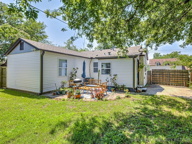 3215 W 41st St, Tulsa, OK 74107 - back of property with a patio area and a shingled roof