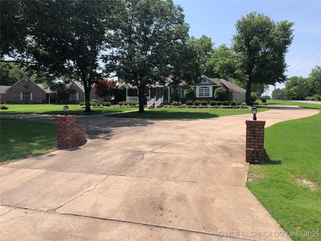 17704 E 92nd St, Owasso, OK 74055 - view of front of home with a front yard and curved driveway