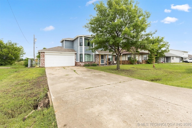4211 E 101st St N, Sperry, OK 74073 - view of front of house featuring concrete driveway, brick siding, a garage, and a front yard