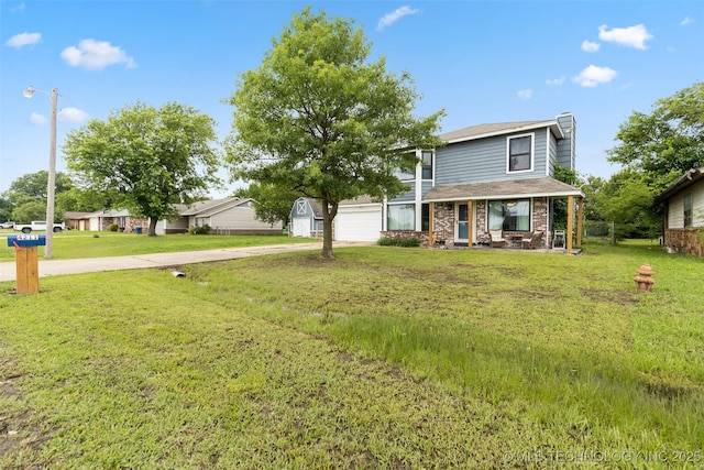 4211 E 101st St N, Sperry, OK 74073 - view of front of property with a porch, concrete driveway, a front yard, and an attached garage