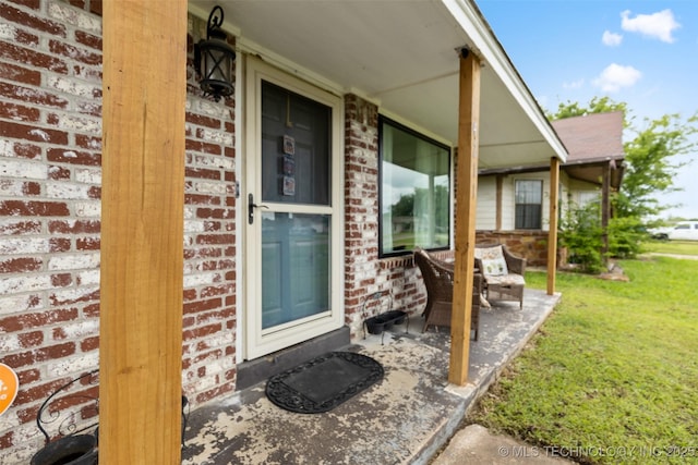 4211 E 101st St N, Sperry, OK 74073 - doorway to property with brick siding and a yard