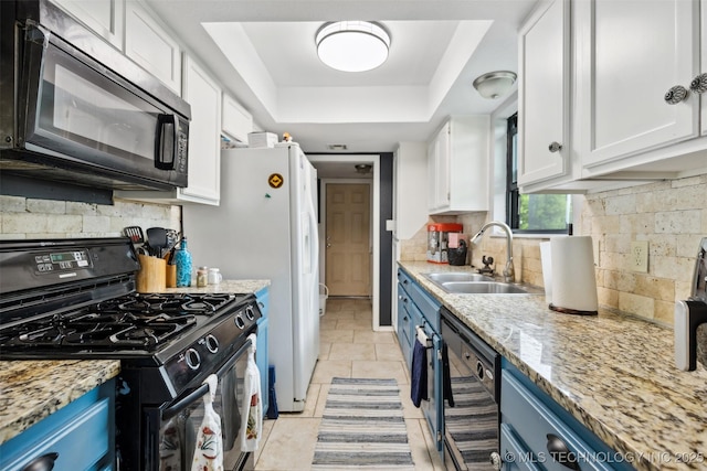 4211 E 101st St N, Sperry, OK 74073 - kitchen featuring black appliances, blue cabinetry, a sink, and white cabinetry
