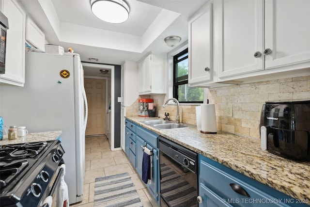 4211 E 101st St N, Sperry, OK 74073 - kitchen with blue cabinets, black dishwasher, a sink, and white cabinetry
