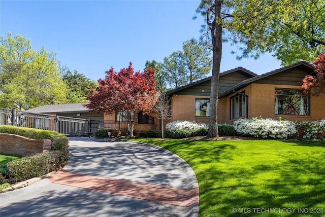 1919 E 30th Pl, Tulsa, OK 74114 - view of front of house with brick siding and driveway