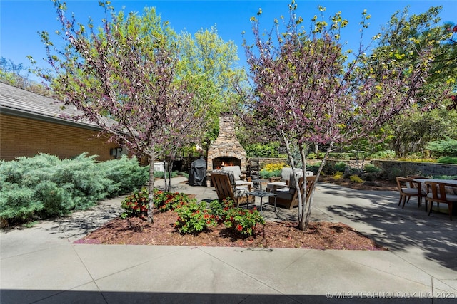 1919 E 30th Pl, Tulsa, OK 74114 - view of patio featuring an outdoor stone fireplace