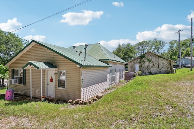 528 S Muskogee, Tahlequah, OK 74464 - rear view of house featuring a lawn, cooling unit, and metal roof