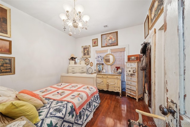 528 S Muskogee, Tahlequah, OK 74464 - bedroom featuring a chandelier and dark wood-style floors