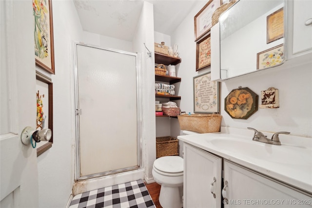 528 S Muskogee, Tahlequah, OK 74464 - full bath with toilet, vanity, a stall shower, and wood finished floors