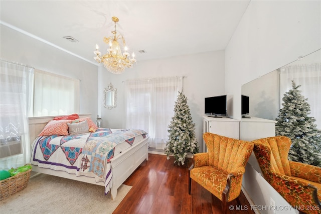 528 S Muskogee, Tahlequah, OK 74464 - bedroom featuring a chandelier, wood finished floors, and cooling unit