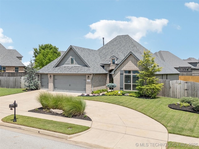 12909 S First St, Jenks, OK 74037 - view of front of property with brick siding, driveway, and a shingled roof