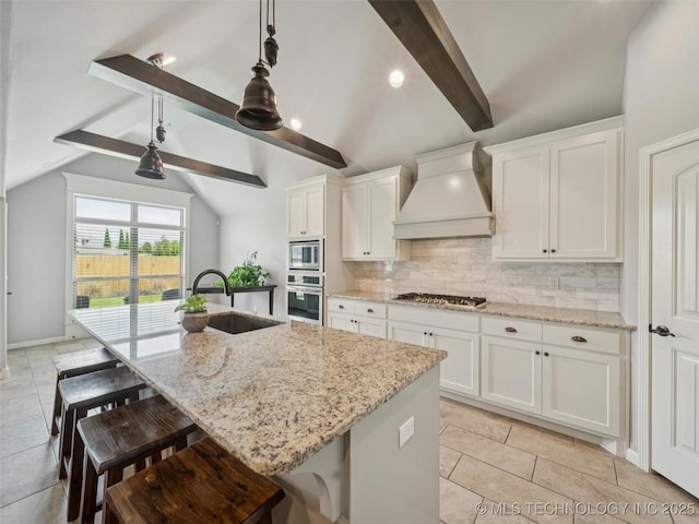 12909 S First St, Jenks, OK 74037 - kitchen with appliances with stainless steel finishes, a sink, premium range hood, backsplash, and a kitchen bar