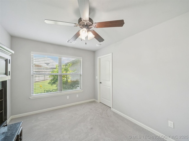 12909 S First St, Jenks, OK 74037 - unfurnished bedroom with carpet, baseboards, and a ceiling fan