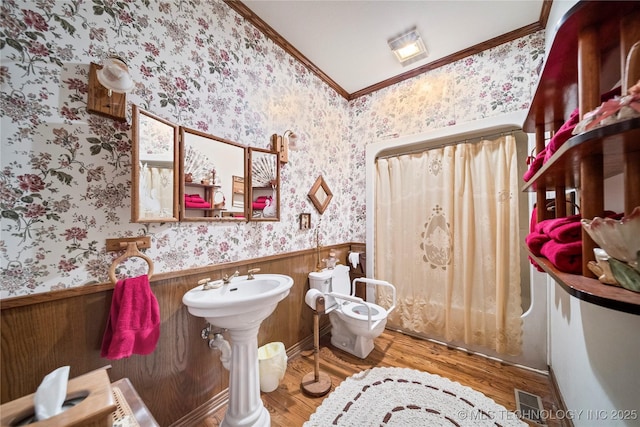 11601 S 193rd E Ave, Broken Arrow, OK 74014 - full bath featuring wallpapered walls, wood finished floors, a wainscoted wall, ornamental molding, and toilet