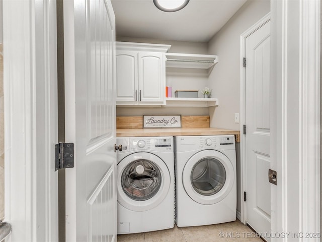 12411 E 90th St N, Owasso, OK 74055 - laundry room featuring independent washer and dryer, cabinet space, and light tile patterned flooring