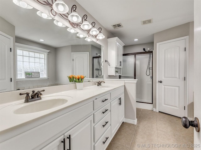 12411 E 90th St N, Owasso, OK 74055 - full bath with double vanity, a shower stall, tile patterned flooring, baseboards, and recessed lighting