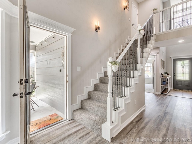 12411 E 90th St N, Owasso, OK 74055 - foyer featuring wood finished floors, stairway, baseboards, and a high ceiling