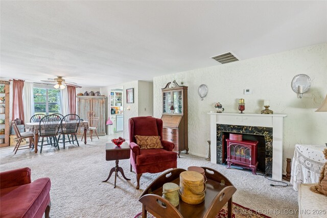 242 Weatherman St, Kellyville, OK 74039 - carpeted living room with ceiling fan and a textured wall