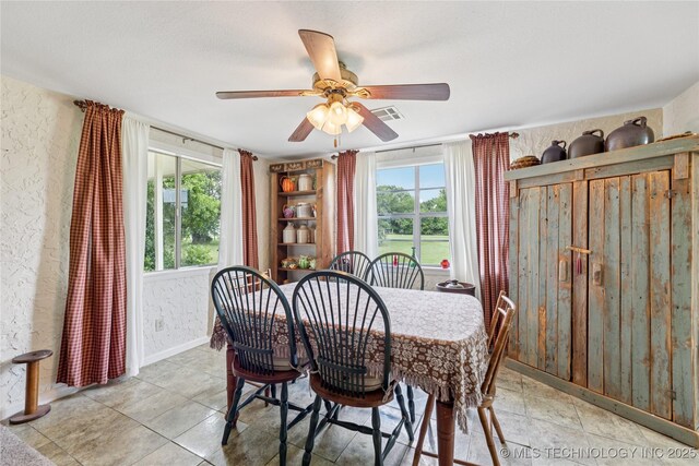 242 Weatherman St, Kellyville, OK 74039 - dining room with a textured wall, baseboards, and ceiling fan