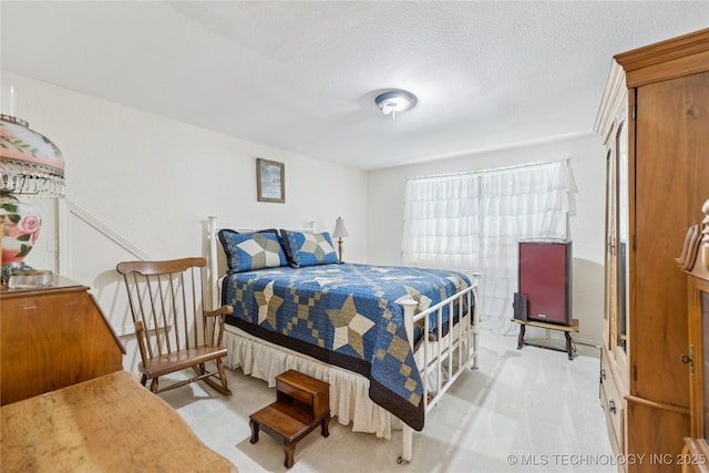 242 Weatherman St, Kellyville, OK 74039 - bedroom with light colored carpet and a textured ceiling