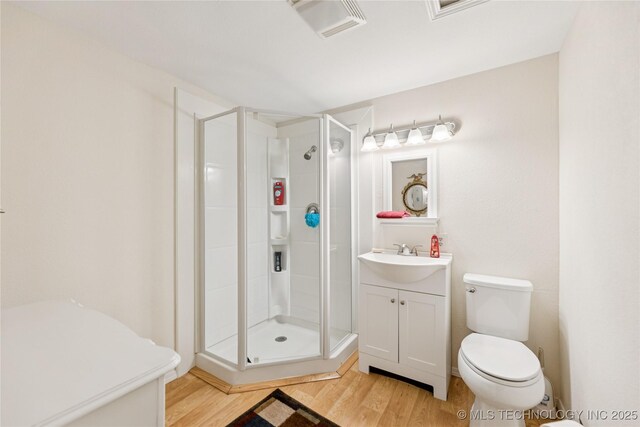 242 Weatherman St, Kellyville, OK 74039 - full bath with wood finished floors, vanity, and a shower stall