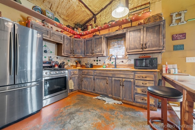 3819 129th Rd, Panola, OK 74559 - kitchen featuring stainless steel appliances, a sink, light countertops, concrete flooring, and high vaulted ceiling
