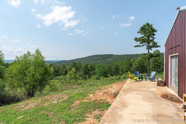 3819 129th Rd, Panola, OK 74559 - view of yard featuring a view of trees and a patio area