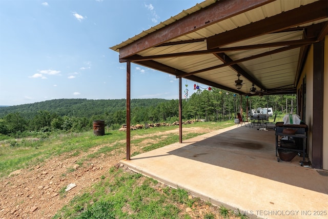 3819 129th Rd, Panola, OK 74559 - view of patio featuring a forest view