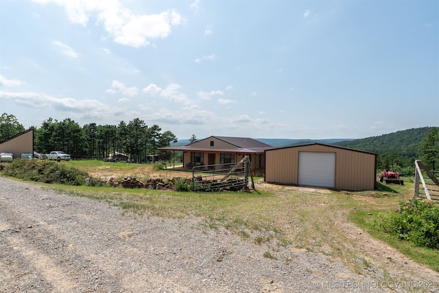 3819 129th Rd, Panola, OK 74559 - view of yard featuring driveway, an outbuilding, and a garage