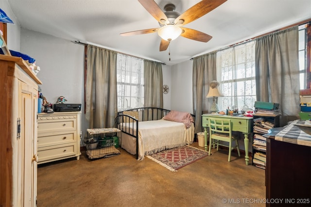3819 129th Rd, Panola, OK 74559 - bedroom featuring finished concrete flooring and a ceiling fan