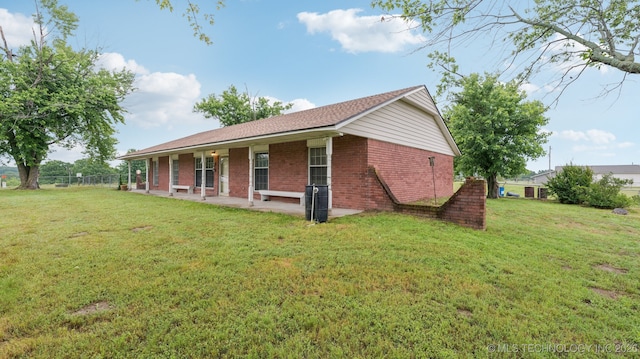 22112 W Coyote Trl Unit S, Sand Springs, OK 74063 - view of home's exterior featuring brick siding