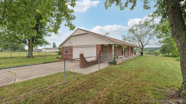 22112 W Coyote Trl Unit S, Sand Springs, OK 74063 - view of home's exterior with brick siding, a porch, a garage, and driveway