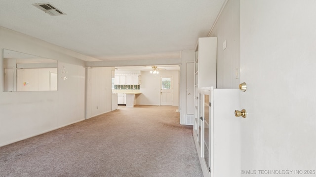 22112 W Coyote Trl Unit S, Sand Springs, OK 74063 - spare room featuring carpet floors, ceiling fan, and baseboards