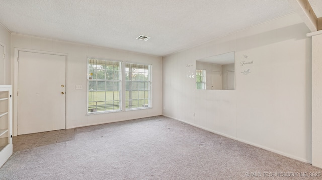 22112 W Coyote Trl Unit S, Sand Springs, OK 74063 - spare room with carpet and a textured ceiling