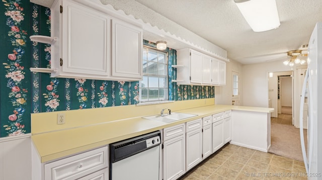 22112 W Coyote Trl Unit S, Sand Springs, OK 74063 - kitchen featuring white appliances, wallpapered walls, a textured ceiling, white cabinetry, and a sink