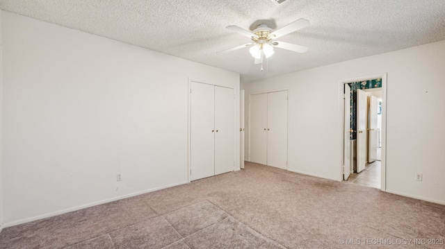 22112 W Coyote Trl Unit S, Sand Springs, OK 74063 - unfurnished bedroom with carpet flooring, a textured ceiling, and ceiling fan