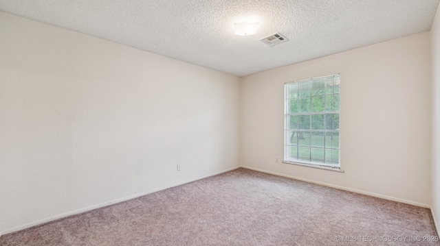 22112 W Coyote Trl Unit S, Sand Springs, OK 74063 - carpeted empty room with a textured ceiling and baseboards