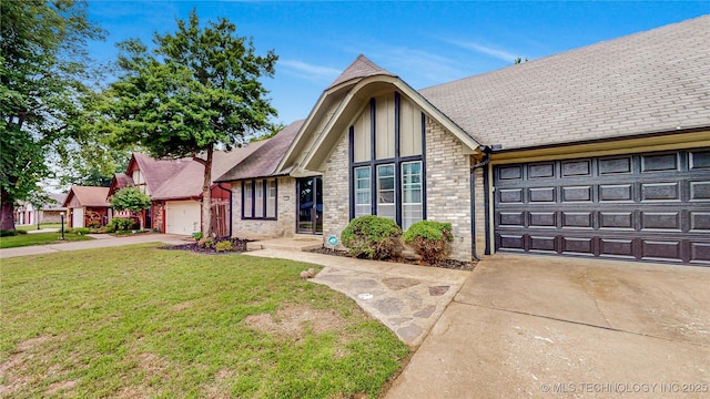 1120 N Juniper Pl, Broken Arrow, OK 74012 - view of front of home featuring driveway, an attached garage, a front yard, and brick siding