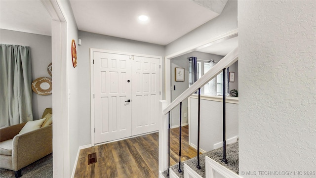 1120 N Juniper Pl, Broken Arrow, OK 74012 - foyer entrance with stairs, dark wood-style floors, a textured wall, and baseboards