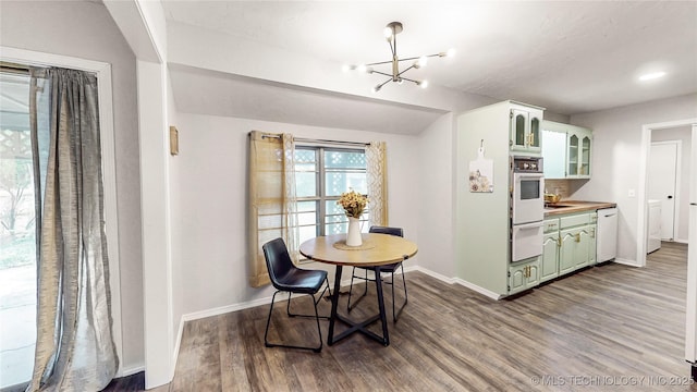 1120 N Juniper Pl, Broken Arrow, OK 74012 - dining space featuring baseboards, a chandelier, and wood finished floors