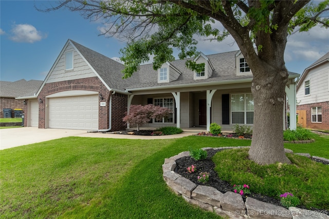 324 E 125th Pl S, Jenks, OK 74037 - cape cod house featuring an attached garage, a front yard, driveway, a shingled roof, and brick siding