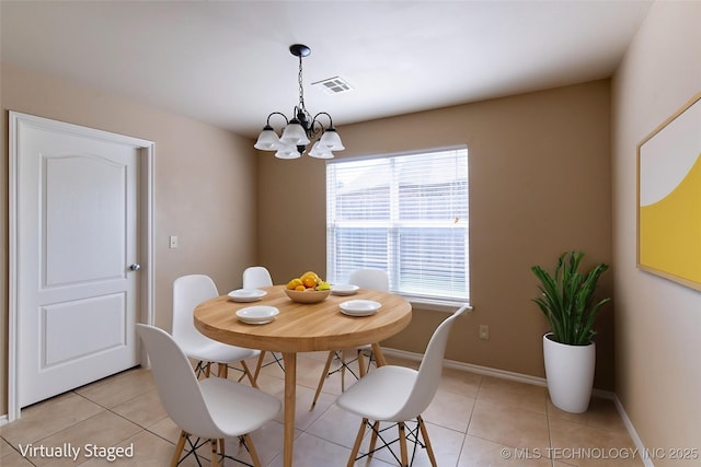 324 E 125th Pl S, Jenks, OK 74037 - dining space with a chandelier, light tile patterned floors, and baseboards