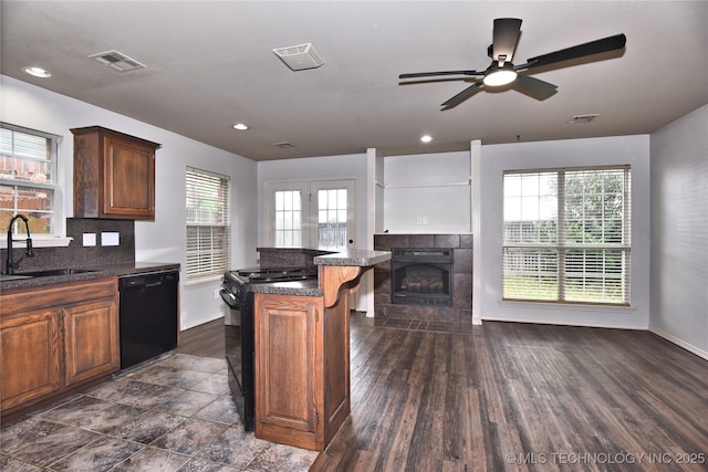 307 W K St, Jenks, OK 74037 - kitchen featuring black appliances, a sink, baseboards, ceiling fan, and recessed lighting