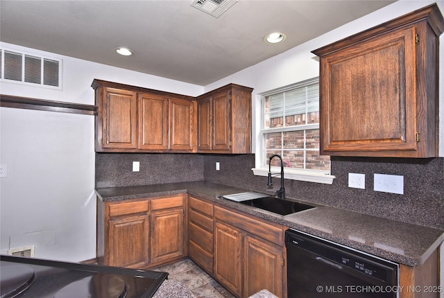 307 W K St, Jenks, OK 74037 - kitchen with black dishwasher, a sink, dark countertops, backsplash, and recessed lighting