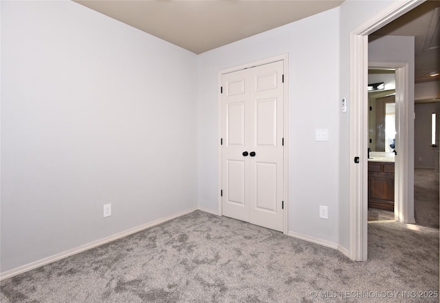 307 W K St, Jenks, OK 74037 - unfurnished bedroom featuring carpet floors and baseboards